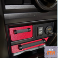 Car dashboard drawers with in red with black handles