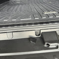 Bumper Bolt cover and bolt that it covers. Image shows the difference between a covered bolt and an exposed one