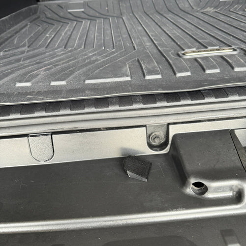 Bumper Bolt cover and bolt that it covers. Image shows the difference between a covered bolt and an exposed one