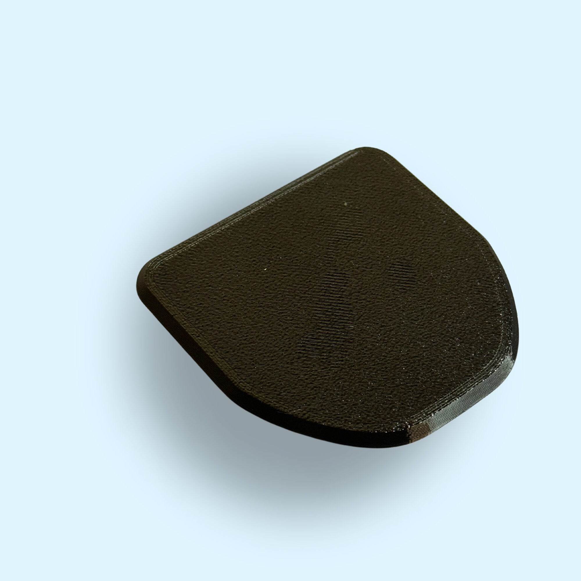 A single d-ring cover. Showing a close up of the detail of the rear cover (closest to the hatch)